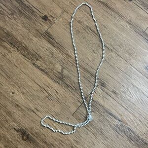 Long white iridescent bead necklace